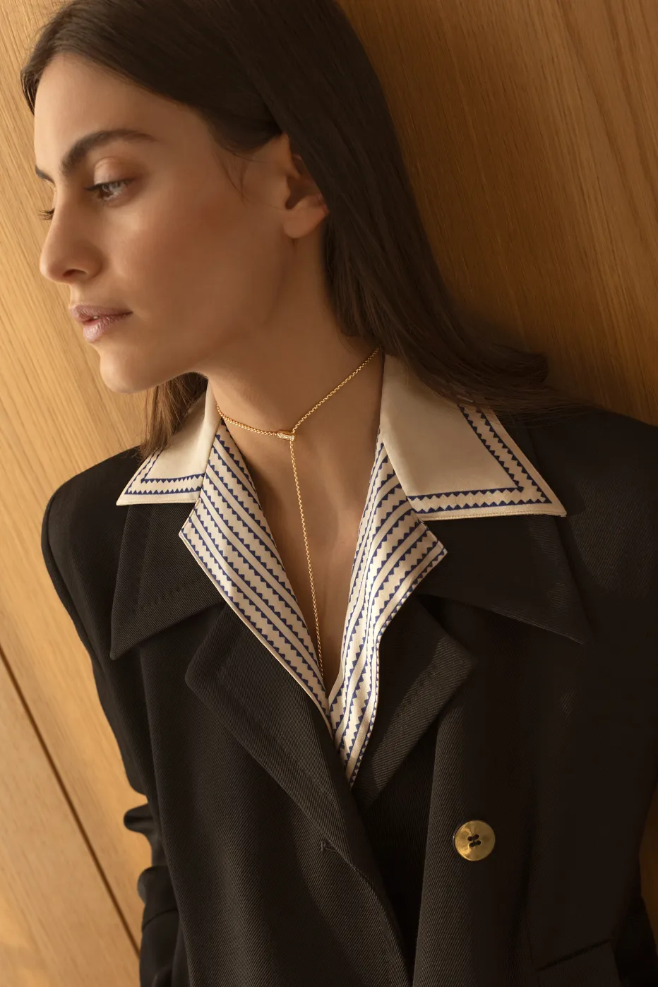 Aria Pendant on model in suit