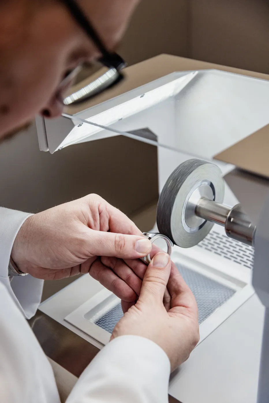 Stuart polishing part of a Rolex